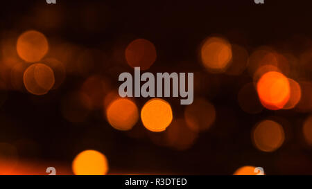Beautiful orange and fiery bokeh bubbles from the street lights of Zurich, Switzerland Stock Photo