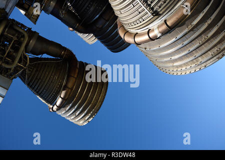 Apollo Saturn V booster rocket with large powerful liquid oxygen fueled rocket engines and blue sky background Stock Photo