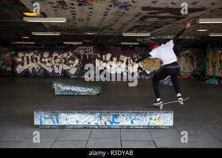 Skateboarders under the Queen Elizabeth Hall along the Southbank area of central London, England, United Kingdom Stock Photo