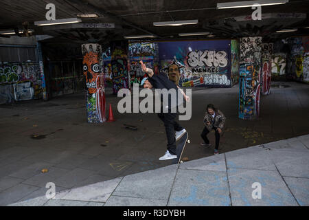 Skateboarders under the Queen Elizabeth Hall along the Southbank area of central London, England, United Kingdom Stock Photo