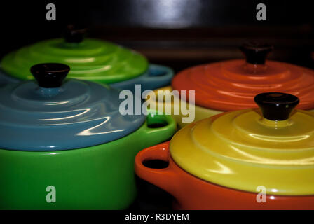 Four colorful and vibrant bowls aligned Stock Photo