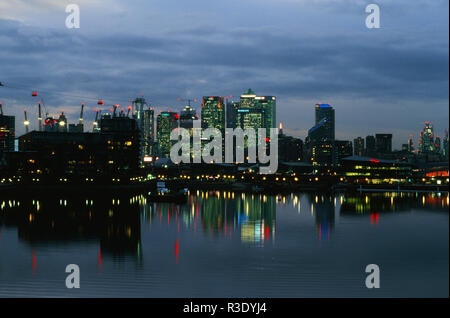 Canary Wharf on the Isle of Dogs at dusk, from Royal Victoria Dock, East London UK Stock Photo