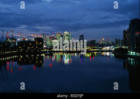 Canary Wharf and London Docklands at night, from Royal Victoria Dock Stock Photo