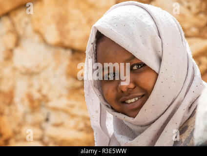 Portrait of a smiling veiled harari woman, Harari Region, Harar, Ethiopia Stock Photo