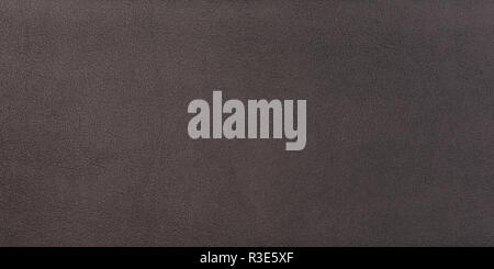 Black shiny leather surface as a background, leather texture. Sk Stock Photo