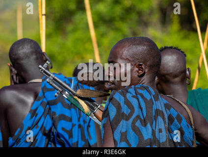 Suri tribe warriors during a donga stick fighting ritual, Omo valley, Kibish, Ethiopia Stock Photo