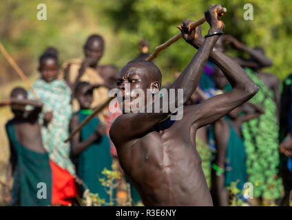 Suri tribe warriors fighting during a donga stick ritual, Omo valley, Kibish, Ethiopia Stock Photo