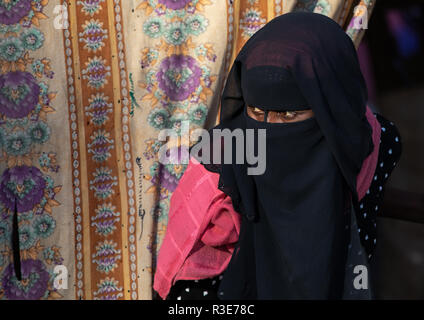Oromo woman wearing a burqa in the market, Amhara region, Senbete, Ethiopia Stock Photo