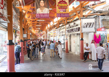DUBAI, UAE - November 09, 2018: crowd in Dubai spice souk in Deira district. People visiting Spices shops in old town of Dubai - United Arab Emirates Stock Photo