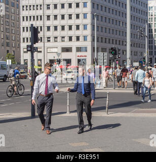 BERLIN, GERMANY - AUGUST 25, 2016: Business Men And Tourists At Potsdamer Platz, Berlin Germany Stock Photo