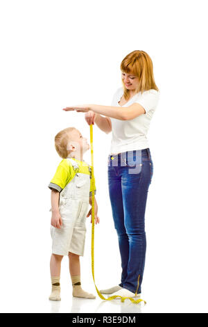 woman measuring child isolated on a white background Stock Photo