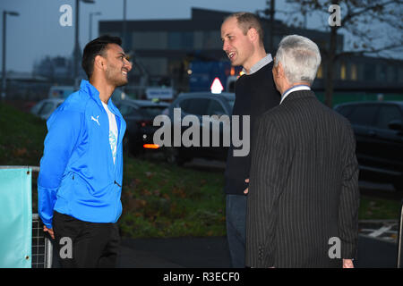 The Duke of Cambridge speaks with Lt Col Roderick Morriss (right) as arrives to attend the graduation ceremony of 30 Young Peace Leaders from Football for Peace's UK City for Peace programme at the Copper Box Arena in Queen Elizabeth Olympic Park, London. Stock Photo