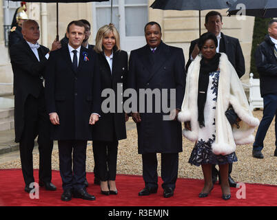 Brigitte Macron President Of French Republic Emmanuel Macron Ioc President Thomas Bach And His Wife Claudia Pose In Front Of The Statue Of Pierre De Coubertin During The Visit Of Paris 24