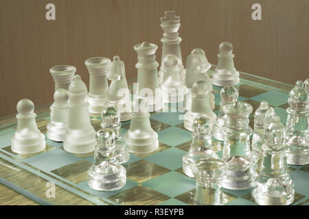 Chessboard and pieces made from glass. An illustration of a chess board and pieces in a realistic setting. Stock Photo