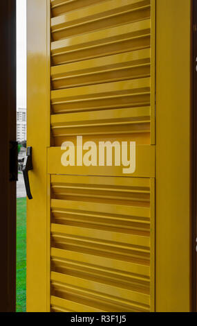 Background surface of open metal and yellow window shutter Stock Photo