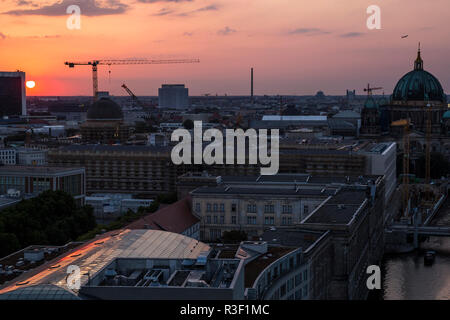 The sun sets over the north of Berlin, seen from the Fischerinsel in Berlin, Germany. Stock Photo