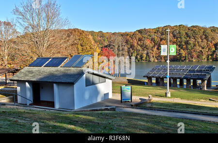 Solar hot water heaters on bathroom roof,  with solar panels in background, facilitating Melton Hill Dam Sustainable Recreation Area Campground. Stock Photo
