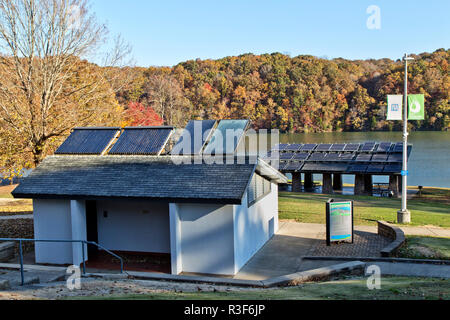 Solar hot water heaters on bathroom roof,  with solar panels in background, facilitating Melton Hill Dam Recreation Area Campground. Stock Photo