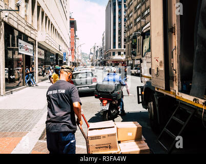 Cape Town, South Africa, February 9, 2018: Unloading delivery truck in downtown Cape Town, South Africa Stock Photo