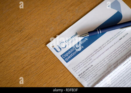 A picture shows a Universal Credit Capability for Work questionnaire form being filled out by a person off work with long term illness. UK. Nov 18. Stock Photo