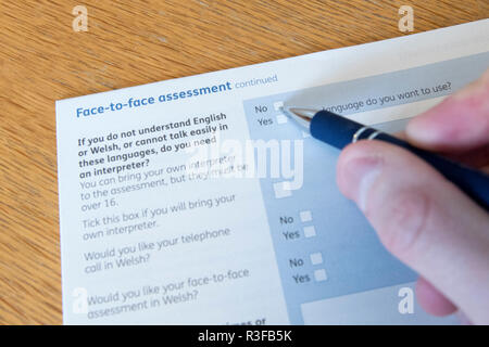 A picture shows a Universal Credit Capability for Work questionnaire form being filled out by a person off work with long term illness. UK. Nov 18. Stock Photo