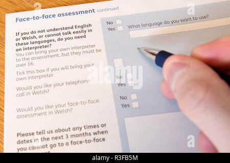 A picture shows a Universal Credit Capability for Work questionnaire form being filled out by a person off work with long term illness. UK. Nov 18. Stock Photo