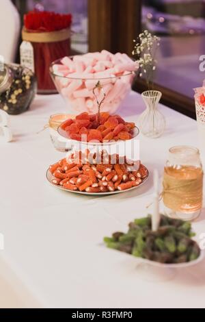 Candy Bar. Delicious sweet buffet with cupcakes and jelly beans Stock Photo