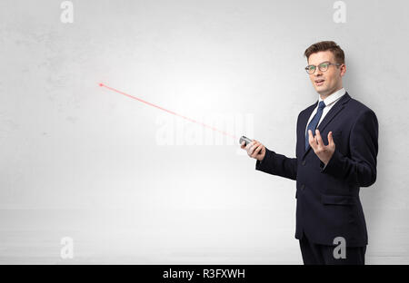 Handsome businessman with laser pointer presenting potential exit from ...
