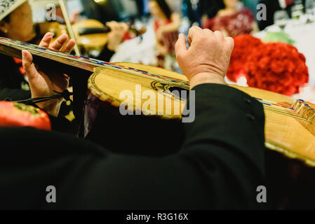 Mexican musician with his trumpet and guitars Stock Photo