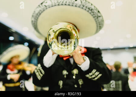 Mexican musician with his trumpet and guitars Stock Photo