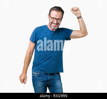 Handsome middle age hoary senior man wearin glasses over isolated background Dancing happy and cheerful, smiling moving casual and confident listening Stock Photo