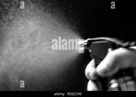 Water jet spraying on black background Stock Photo