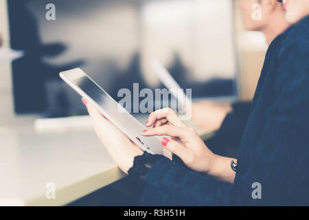 businessmen and group using notebook and tablet for business partners discussing documents and ideas at meeting Stock Photo