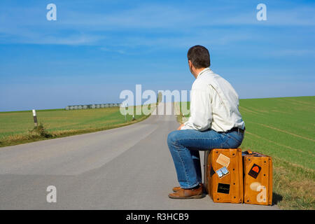 hitchhiker on a country road Stock Photo