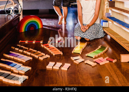 Children playing with wooden rainbow waldorf montessori Stock Photo - Alamy