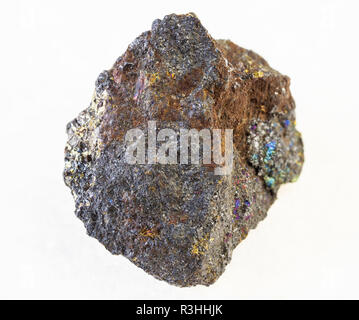 macro photography of natural mineral from geological collection - raw magnetite (iron ore) stone on white background Stock Photo