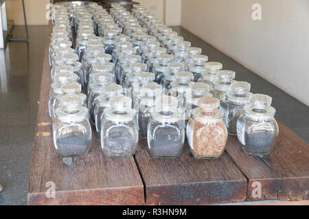 Collage of rocks and minerals, semiprecious stones in the glass jars Stock Photo
