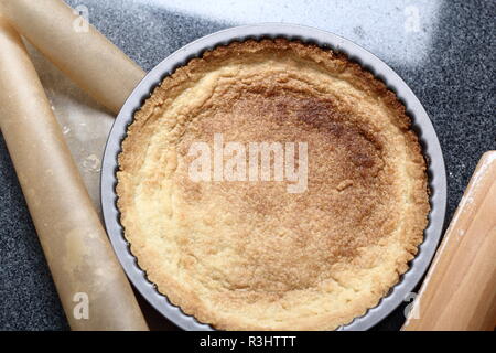 Freshly Baked Tart Base in Tin. Making Boston Banoffee Pie. Stock Photo