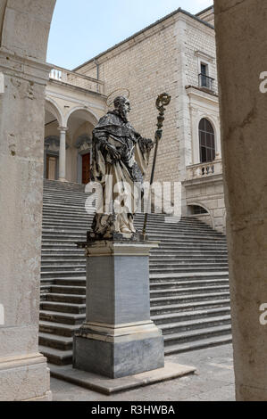 Montecassino, Italy - June 17, 2017: Marble statue of St. Benedict by P. Campi of Carrara, Cloister of Bramante, Benedictine abbey of Montecassino, Mo Stock Photo