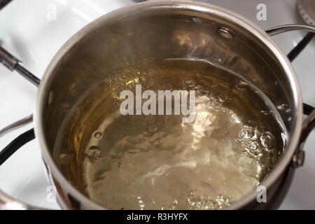 Boiling Cider in Pan on Gas Stove. Making Cider Pie Series. Stock Photo