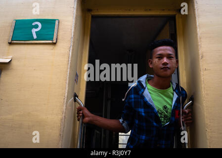 Portrait of a young Burmese man on board a train at the Mandalay Railway Station,  Mandalay, Myanmar. Stock Photo