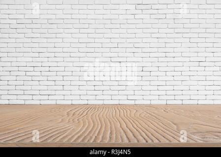 Abstract background from wooden table top with white brick wall background. Picture for add text message. Backdrop for design art work. Stock Photo