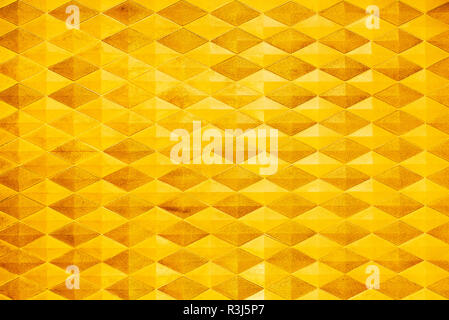 Abstract background from golden brick pattern decoration on wall. Luxury texture interior. Stock Photo