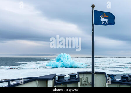 Flag of Gotland, Blue Iceberg drifting in Hinlopen Strait, Spitsbergen Island, Svalbard archipelago, Norway Stock Photo