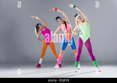Beautiful Sporty Girls 80S Style Sportswear Posing Together Isolated Grey  Stock Photo by ©EdZbarzhyvetsky 223180814