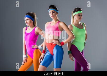 Attractive Sporty Girls In Bodysuits Training At Aerobics Workout On Grey  Stock Photo - Download Image Now - iStock