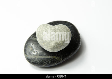 gray heart on black stone Stock Photo