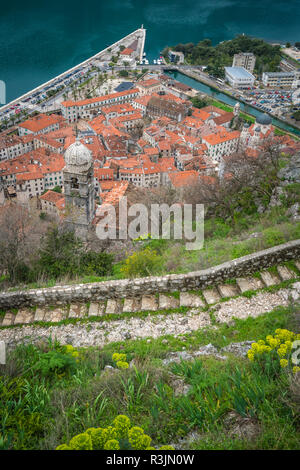 Stony trail and steps leading to the Kotor fortress above Kotor town, Montenegro Stock Photo