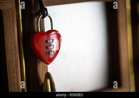 Close up shot of a heart-shaped padlock with numbers. Stock Photo