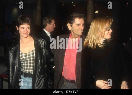 HOLLYWOOD, CA - FEBRUARY 10: (L-R) Actress Ally Sheedy, actor Harry Dean Stanton and actress Rebecca De Mornay attend 'Strictly Ballroom' Premiere on February 10, 1993 at the Galaxy Theatre in Hollywood, California. Photo by Barry King/Alamy Stock Photo Stock Photo